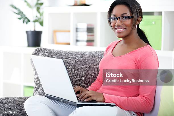 African Woman Using Laptop Stock Photo - Download Image Now - African Ethnicity, Learning, Teenager