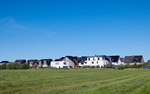 Panoramic view of a new settlement with diverse one family houses.