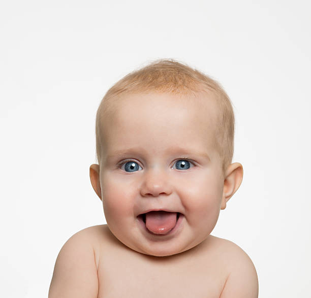 istock Baby Sticking Tongue Out Smiling 166124881