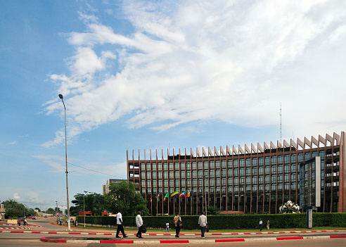 Libreville, Estuaire Province, Gabon: people by the Economic Community of Central African States (ECCAS / CEEAC) headquarters - ECCAS is made of 11 Member States, namely Republic of Angola; Republic of Burundi; Republic of Cameroon; Centrafrican Republic; Republic of Congo; Democratic Republic of Sao Tome and Principe; Democratic Republic of Congo; Gabonese Republic; Republic of Equatorial Guinea; Republic of Rwanda; and the Republic of Chad - The Community promotes and supports the Member States in economic matters and in the establishment of a customs union and the resulting creation of a common market, it includes almost 140 million people - the building was previously used by the Bank of Central African States (BEAC) - boulevard Triomphal El Hadj Omar Bongo - Siège CEEAC-ECCAS.