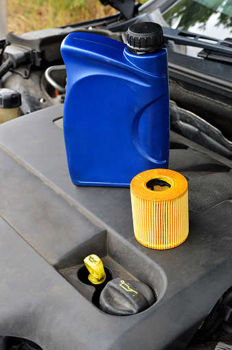 Auto parts with a fuel filter with a can of engine oil, for engine maintenance.