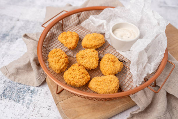 istock Air fried breaded chicken nuggets in a basket with dip and ready to serve 1661262959