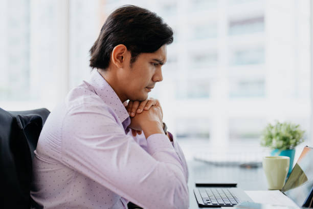 istock Malay businessman serious and concentrating at work 1661273423
