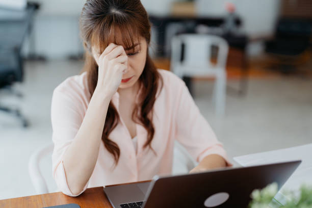 istock Asian businesswoman stressed and exhausted at work 1661273433
