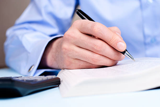 istock hand  and a ballpoint pen 166127884