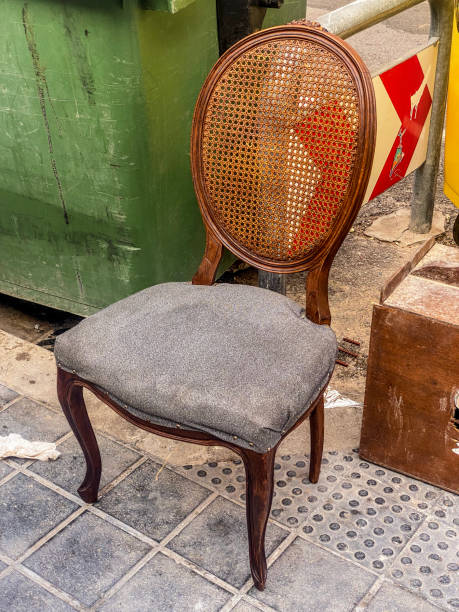 istock Classy old chair left in the street 1661284117