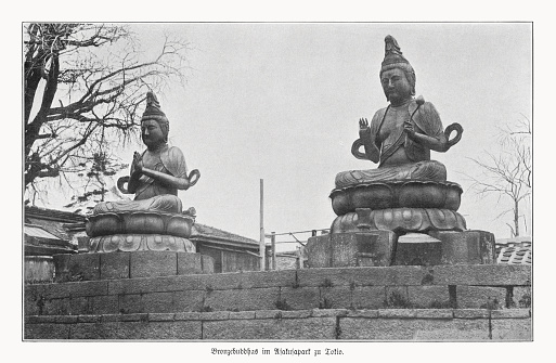 Historical view of the bronze statues of Kannon Bosatsu (right) and Seishi Bosatsu (left) at the Senso- ji temple grounds, Asakusa, Tokyo, Japan. Halftone print after a photograph, published in 1900.