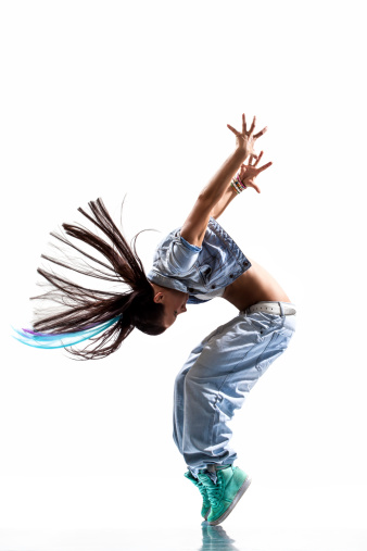 modern dancer poses in front of the studio background