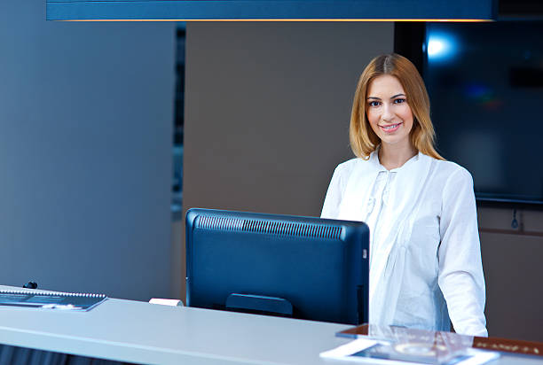 attractive woman receptionist stock photo