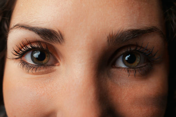 istock Woman's eye mirrors universe, star, soul's reflection 1661310323
