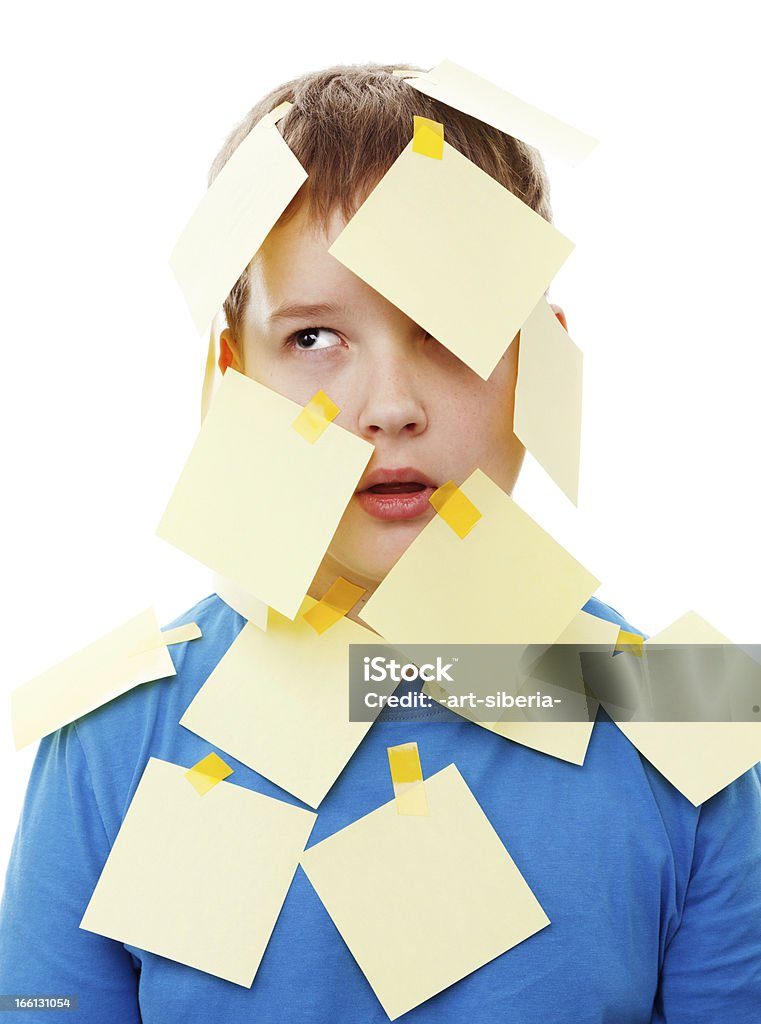 Post-it teenage boy A teenage boy ponders the blank sticky note on his forehead. Your text here! 12-13 Years Stock Photo