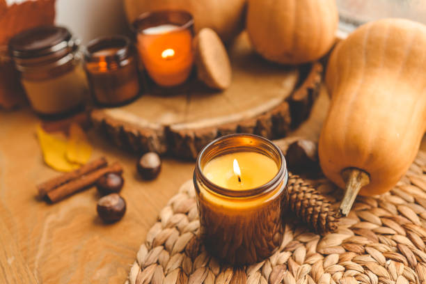 istock Burning candle and autumn decor, home decor aesthetics 1661356435
