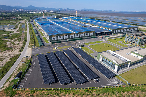 Aerial view of solar power generation in a seaside factory