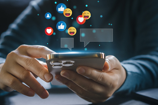 Concept of social media communication and digital online, people use smartphone playing with icon online social media, online marketing, technology, chat, post, like, follow at phone screen