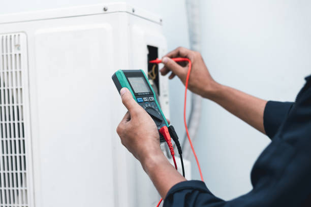 istock Air conditioner technicians use a multimeter to check electricity and Part of the preparation to install a new air conditioner. 1661368708