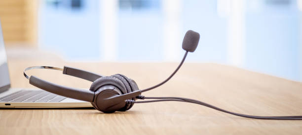 istock Headset and customer support equipment at call center service. 1661368740