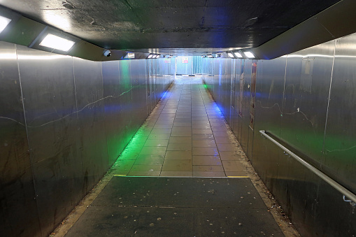 Fort William, Scotland, United Kingdom, July 6, 2023. Dark and atmospheric underpass or subway with shiny florescent lights.  Ethereal and dreamlike. No people