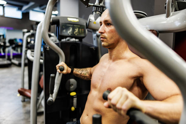 Man exercises chest on machine in the gym ripl fitness