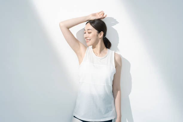 istock Asian woman with one arm up. 1661373920