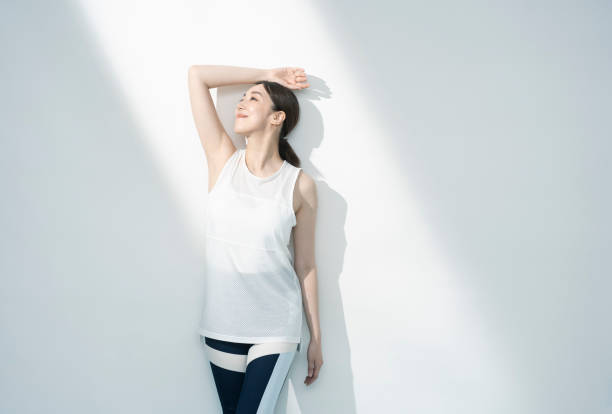 istock Asian woman with one arm up. 1661373926
