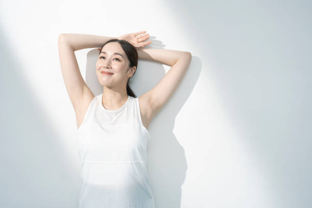 istock Asian woman raising her arms. 1661373942