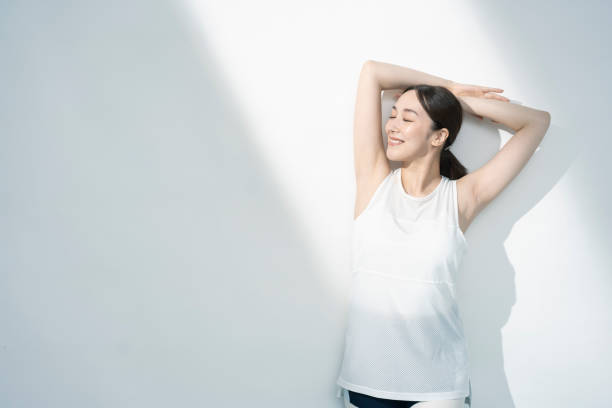istock Asian woman raising her arms. 1661374009