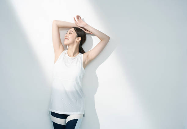 istock Asian woman raising her arms. 1661374448