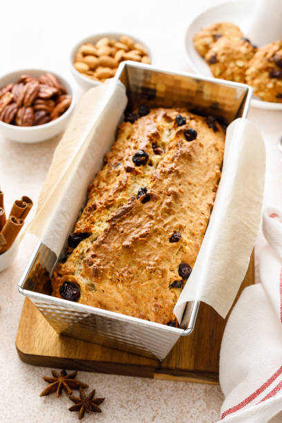istock Fruitcake with cranberry, almond and pecan nuts in baking form 1661386008