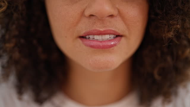 Young beautiful hispanic woman close up of mouth speaking at home