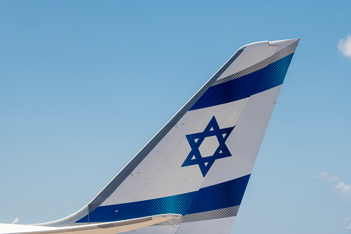 Tel Aviv, Israel April 28, 2023 Tail fin of an El Al aircraft with blue stripes and a blue star of David.