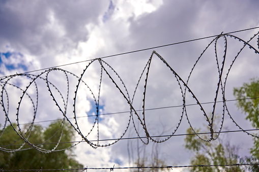 Barbed wire over the fence, prison