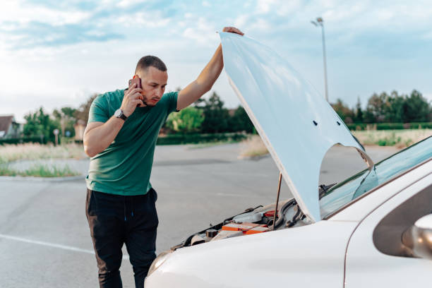 istock A young driver uses his phone to request help after his car breaks down on the road 1661398309