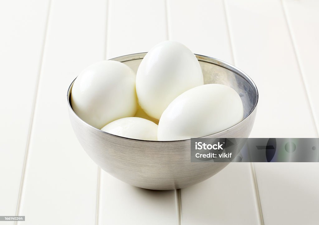 Peeled hard boiled eggs Peeled hard boiled eggs in a metal bowl Boiled Stock Photo