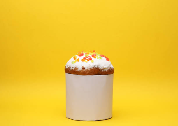 istock Easter cake with white label  on yellow background 1661406685