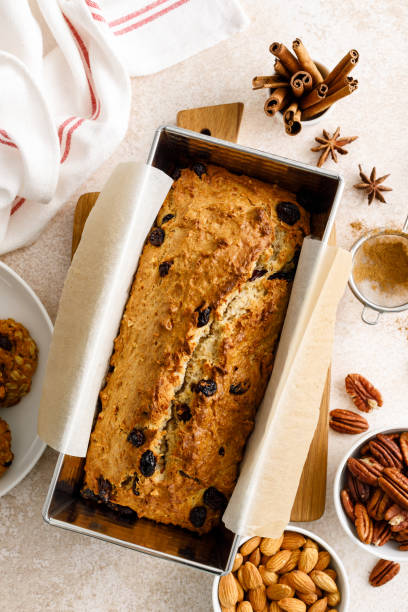 istock Fruitcake with cranberry, almond and pecan nuts in baking form 1661407026