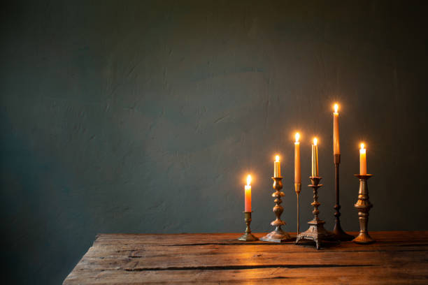 istock burning candles in vintage candlesticks on dark background 1661408216