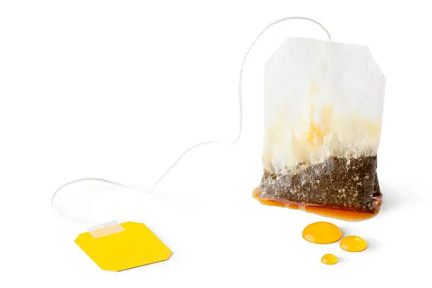 Used wet teabag. Isolated on a white.