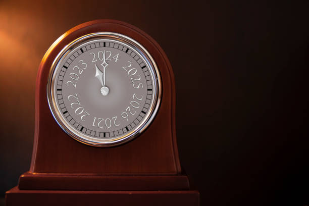 Antique wooden clock is changing from 2023 to 2024