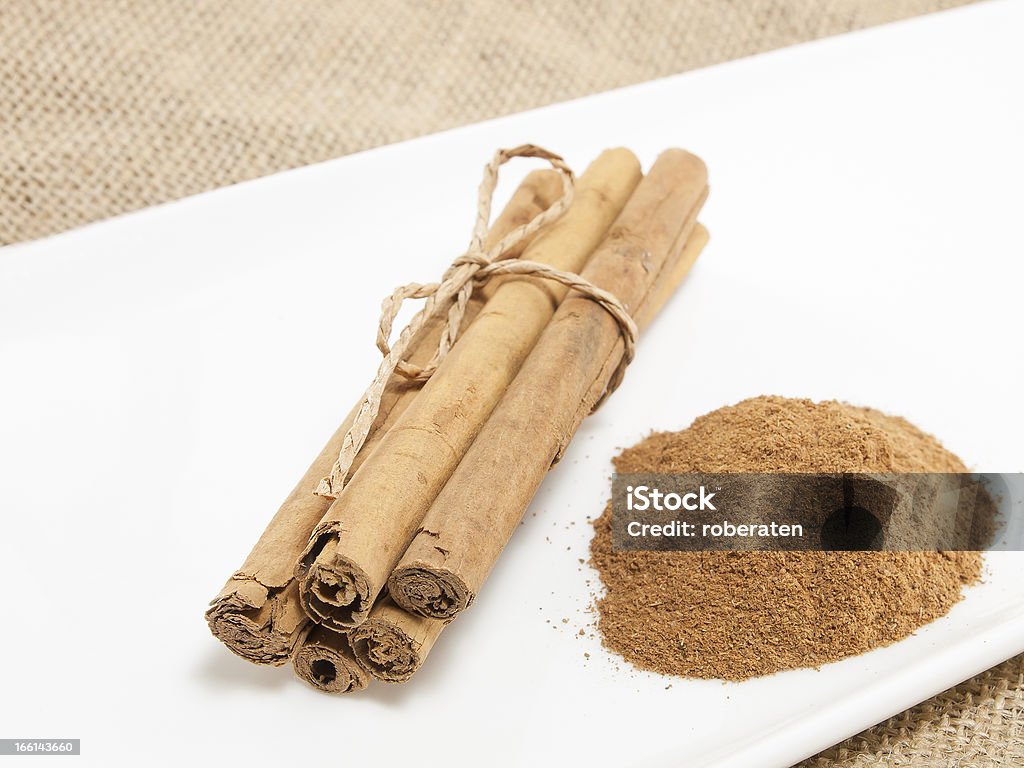cinnamon Cinnamon Sticks and cinnamon in powder. Brown Stock Photo