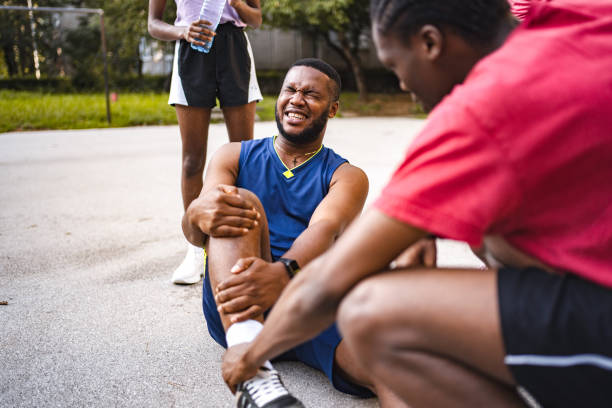 istock Young black man experiencing pain after injuring his leg while playing basketball 1661441221