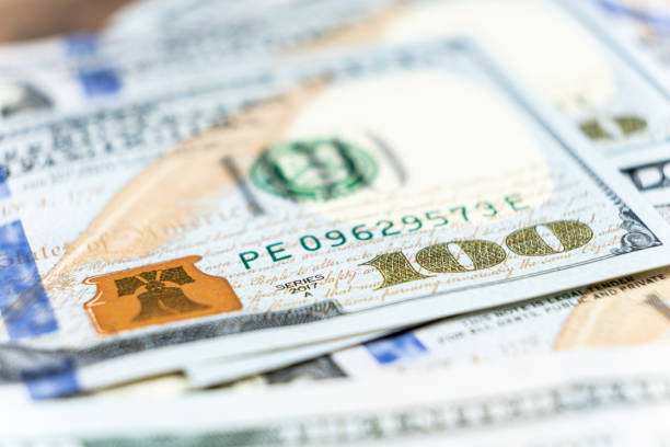 istock A lot of 100 dollar bills close-up macro. 1661441798