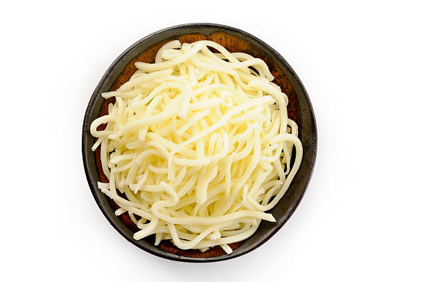 mozzarella cheese on bowl mozzarella cheese on bowl shredded mozzarella stock pictures, royalty-free photos & images