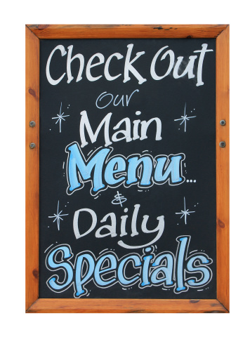 Cafe advertisement sign saying check out our main menu and daily specials, white background.