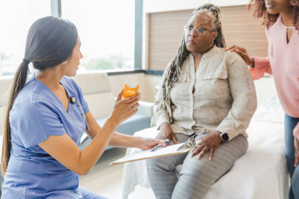 istock Female doctor asks female patient about medication 1661446793