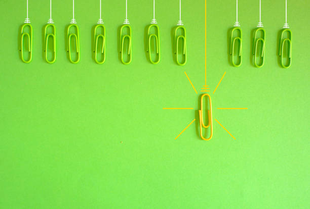 istock concept,metaphor,idea,solution,innovation,idea,unique selling point,start up and human resources concept with paper clips as lightbulbs, flat lay, copy space 1661447689