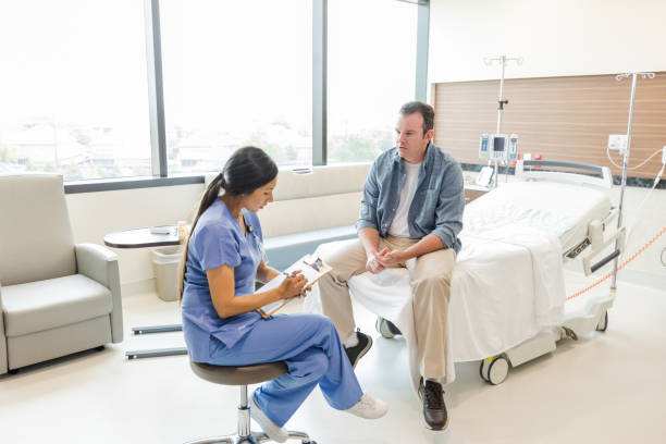 istock Doctor asks patient a question during emergency room visit 1661448248