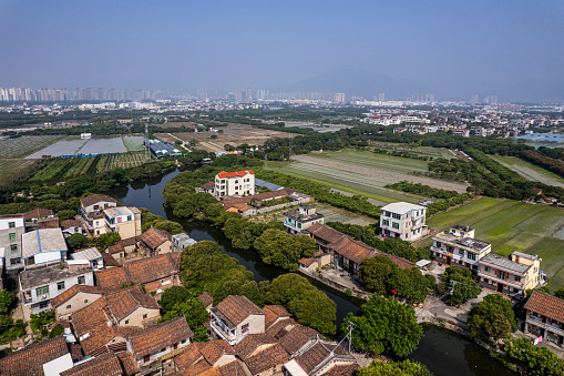 A bird's-eye view of the countryside and farmland by the river