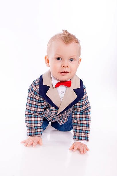 istock baby-boy wearing suit on white background 166144952