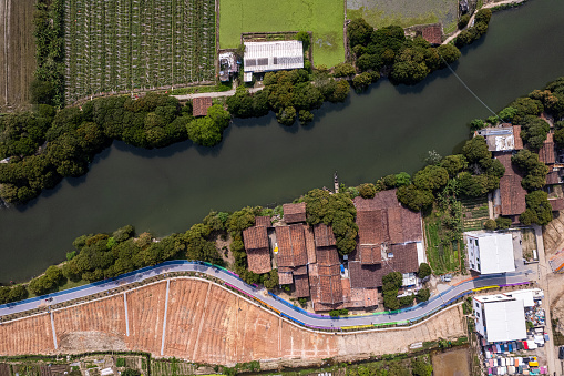 A bird's-eye view of the countryside and farmland by the river