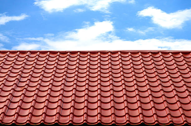 istock red roof with blue sky 166145618